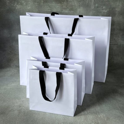 FSC® Luxury Embossed Paper Bags with Cotton Ribbon Handles