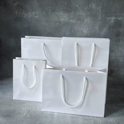 Wholesale FSC White Gloss Laminated Rope Handle Paper Bags