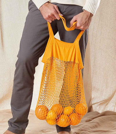person holding Westford Mill Organic Cotton Mesh Grocery Bag amber