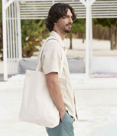 model holding Westford Mill Striped Organic Cotton Tote Bag