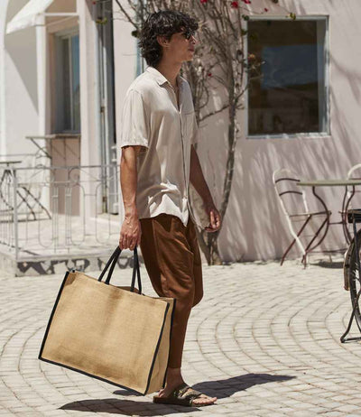 model holding Westford Mill Natural Starched Jute Market Shopper natural/black