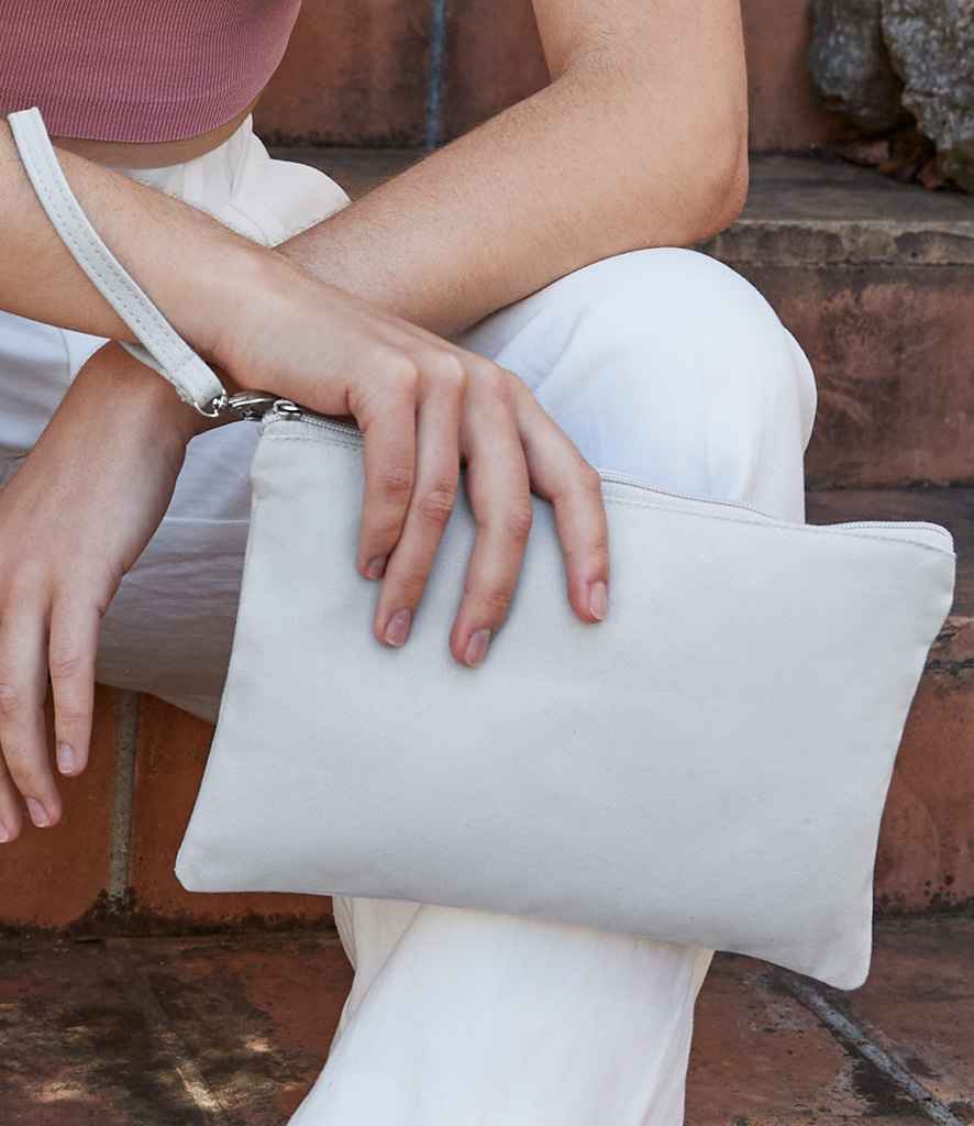 model holding Westford Mill Canvas Wristlet Pouch