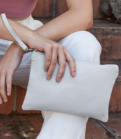 model holding Westford Mill Canvas Wristlet Pouch