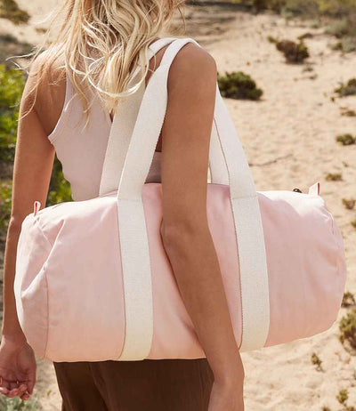 model holding Westford Mill EarthAware® Organic Barrel Bag