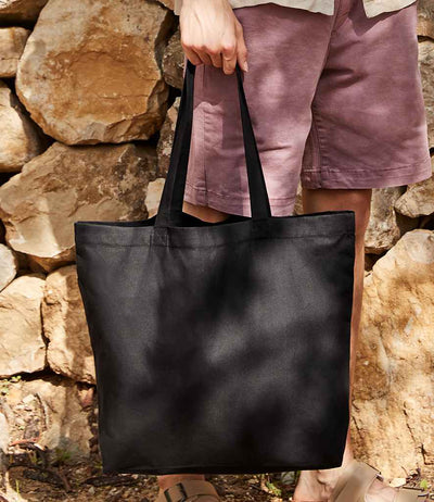 model holding Westford Mill Recycled Cotton Maxi Tote Bag black